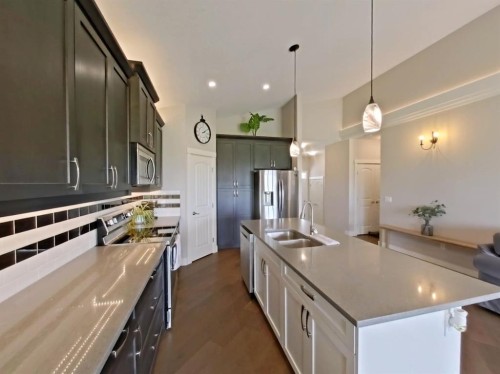 702 Fairways Drive, Vulcan, AB - Indoor Photo Showing Kitchen With Double Sink With Upgraded Kitchen
