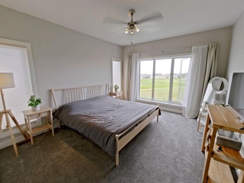 702 Fairways Drive, Vulcan, AB - Indoor Photo Showing Bedroom