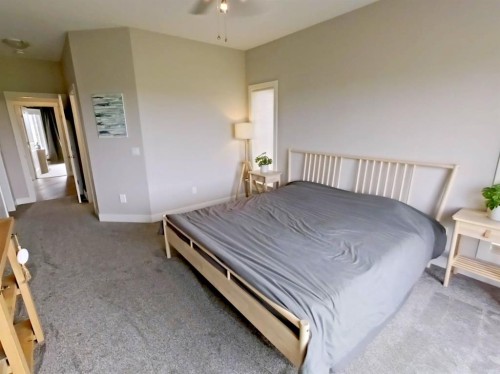 702 Fairways Drive, Vulcan, AB - Indoor Photo Showing Bedroom