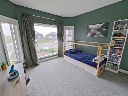 702 Fairways Drive, Vulcan, AB - Indoor Photo Showing Bedroom