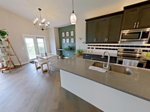 702 Fairways Drive, Vulcan, AB - Indoor Photo Showing Kitchen With Double Sink With Upgraded Kitchen
