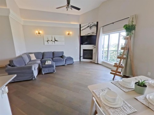 702 Fairways Drive, Vulcan, AB - Indoor Photo Showing Living Room With Fireplace