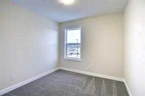 63 Lambeau Lane Se, Airdrie, AB - Indoor Photo Showing Other Room