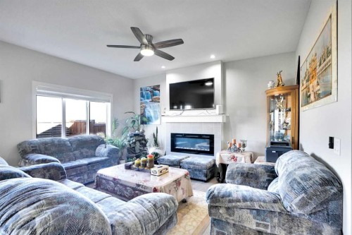 99 Savanna Way Ne, Calgary, AB - Indoor Photo Showing Living Room With Fireplace