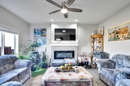 99 Savanna Way Ne, Calgary, AB - Indoor Photo Showing Living Room With Fireplace