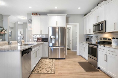 218 Willow Place, Cochrane, AB - Indoor Photo Showing Kitchen With Stainless Steel Kitchen With Upgraded Kitchen