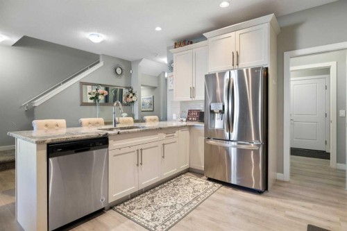 218 Willow Place, Cochrane, AB - Indoor Photo Showing Kitchen With Stainless Steel Kitchen With Upgraded Kitchen