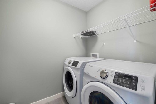 218 Willow Place, Cochrane, AB - Indoor Photo Showing Laundry Room