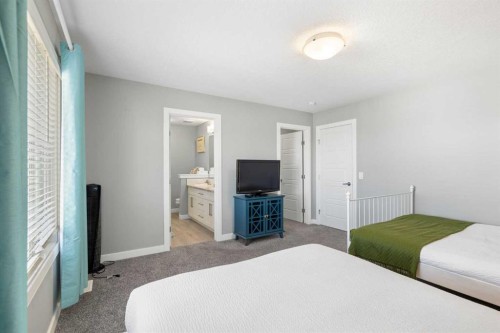 218 Willow Place, Cochrane, AB - Indoor Photo Showing Bedroom