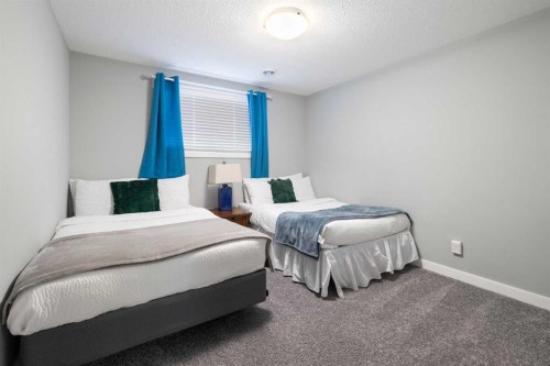 218 Willow Place, Cochrane, AB - Indoor Photo Showing Bedroom