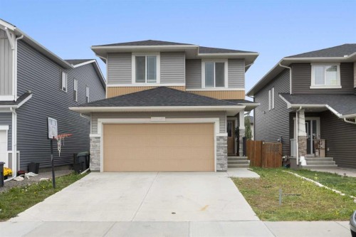 218 Willow Place, Cochrane, AB - Outdoor With Facade
