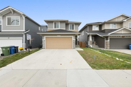 218 Willow Place, Cochrane, AB - Outdoor With Facade