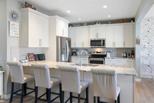 218 Willow Place, Cochrane, AB - Indoor Photo Showing Kitchen With Stainless Steel Kitchen With Upgraded Kitchen