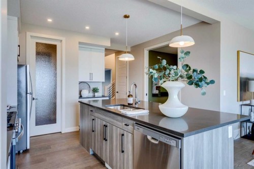 111 Sundown Crescent, Cochrane, AB - Indoor Photo Showing Kitchen With Double Sink