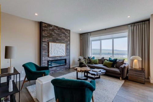 111 Sundown Crescent, Cochrane, AB - Indoor Photo Showing Living Room With Fireplace