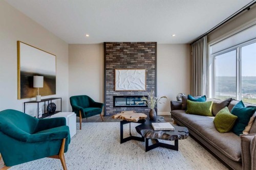 111 Sundown Crescent, Cochrane, AB - Indoor Photo Showing Living Room With Fireplace