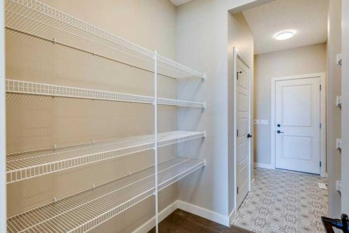 111 Sundown Crescent, Cochrane, AB - Indoor With Storage