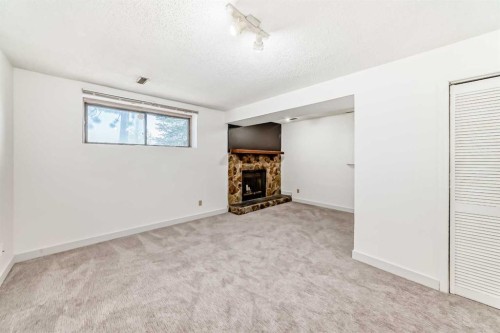 269 Edgepark Boulevard Nw, Calgary, AB - Indoor With Fireplace