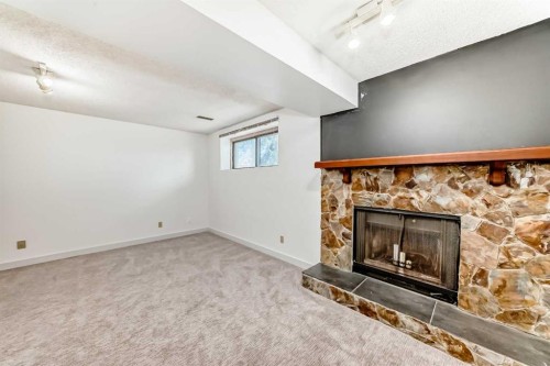 269 Edgepark Boulevard Nw, Calgary, AB - Indoor With Fireplace