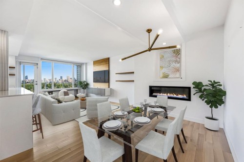 609-3204 Rideau Place Sw, Calgary, AB - Indoor Photo Showing Dining Room With Fireplace