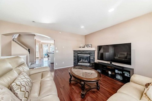 179 Covecreek Place Ne, Calgary, AB - Indoor Photo Showing Living Room With Fireplace