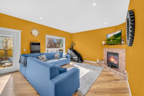 101 Springmere Road, Chestermere, AB - Indoor Photo Showing Living Room With Fireplace