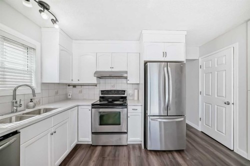 33 Martinridge Place Ne, Calgary, AB - Indoor Photo Showing Kitchen With Double Sink