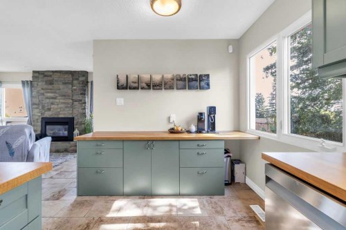 1215 Mapleglade Place Se, Calgary, AB - Indoor Photo Showing Other Room With Fireplace