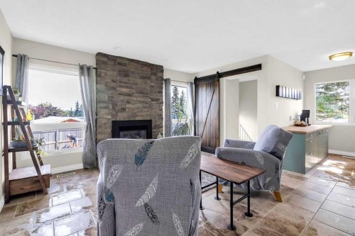 1215 Mapleglade Place Se, Calgary, AB - Indoor Photo Showing Living Room With Fireplace