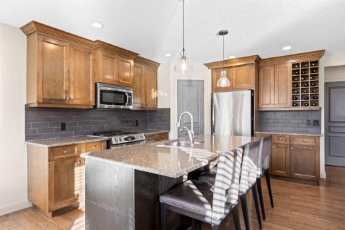 80 Tuscany Summit Terrace Nw, Calgary, AB - Indoor Photo Showing Kitchen With Double Sink With Upgraded Kitchen