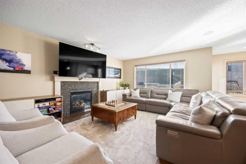80 Tuscany Summit Terrace Nw, Calgary, AB - Indoor Photo Showing Living Room With Fireplace