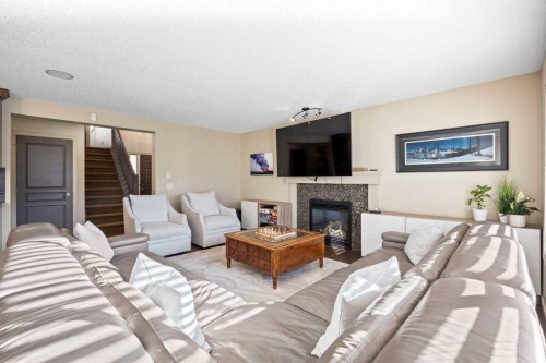80 Tuscany Summit Terrace Nw, Calgary, AB - Indoor Photo Showing Living Room With Fireplace