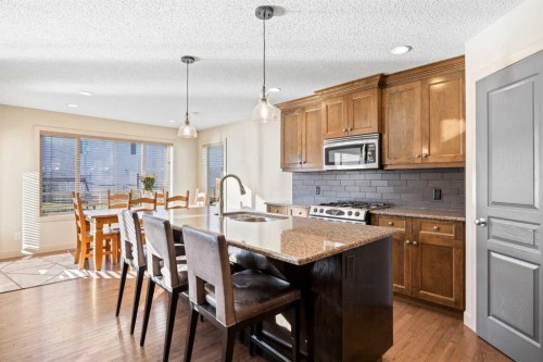 80 Tuscany Summit Terrace Nw, Calgary, AB - Indoor Photo Showing Kitchen With Double Sink With Upgraded Kitchen