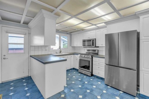 403 Queen Alexandra Way Se, Calgary, AB - Indoor Photo Showing Kitchen With Upgraded Kitchen
