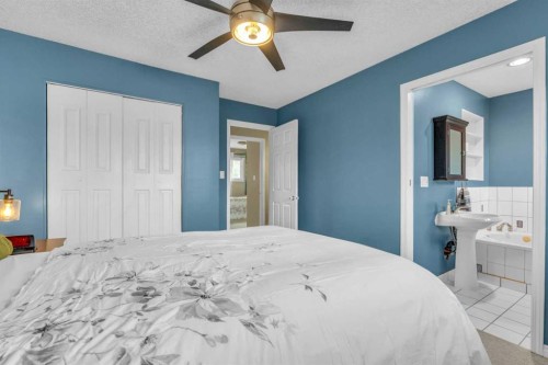 403 Queen Alexandra Way Se, Calgary, AB - Indoor Photo Showing Bedroom