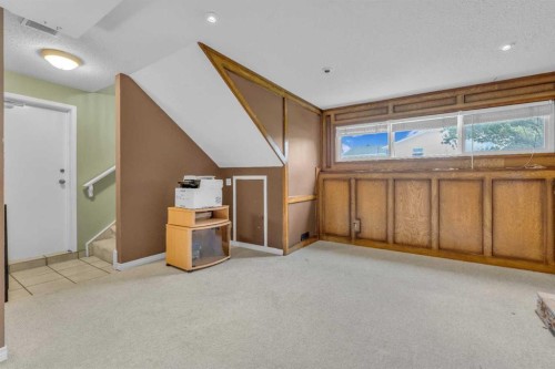 403 Queen Alexandra Way Se, Calgary, AB - Indoor Photo Showing Other Room