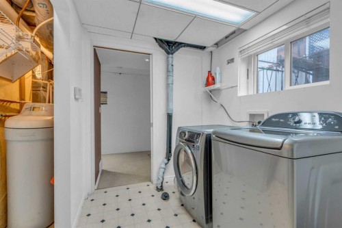 403 Queen Alexandra Way Se, Calgary, AB - Indoor Photo Showing Laundry Room