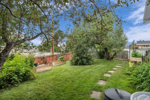 403 Queen Alexandra Way Se, Calgary, AB - Outdoor With Backyard