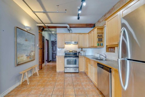 221-220 11 Avenue Se, Calgary, AB - Indoor Photo Showing Kitchen With Stainless Steel Kitchen With Double Sink