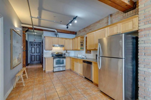 221-220 11 Avenue Se, Calgary, AB - Indoor Photo Showing Kitchen With Stainless Steel Kitchen