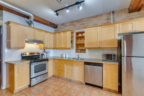 221-220 11 Avenue Se, Calgary, AB - Indoor Photo Showing Kitchen With Stainless Steel Kitchen With Double Sink