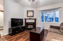 27 Bedfield Close Ne, Calgary, AB  - Indoor Photo Showing Living Room With Fireplace 