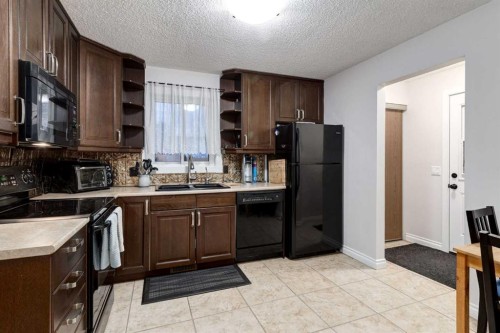 27 Bedfield Close Ne, Calgary, AB - Indoor Photo Showing Kitchen With Double Sink