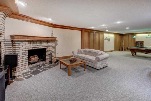 76 Edgeland Road Nw, Calgary, AB - Indoor Photo Showing Other Room With Fireplace