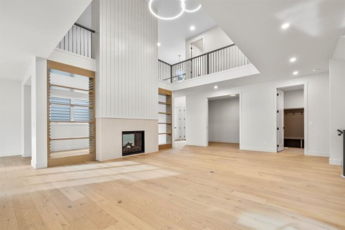 30 Greenwich Row Nw, Calgary, AB - Indoor Photo Showing Other Room With Fireplace