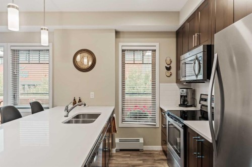204-10 Mahogany Mews Se, Calgary, AB - Indoor Photo Showing Kitchen With Stainless Steel Kitchen With Double Sink With Upgraded Kitchen