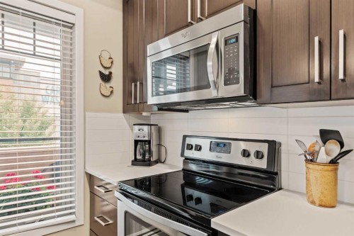 204-10 Mahogany Mews Se, Calgary, AB - Indoor Photo Showing Kitchen With Stainless Steel Kitchen