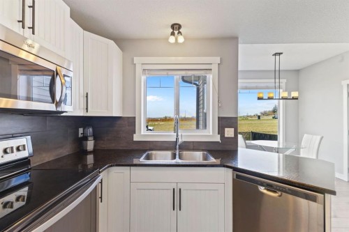 848 Lakewood Circle, Strathmore, AB - Indoor Photo Showing Kitchen With Stainless Steel Kitchen With Double Sink