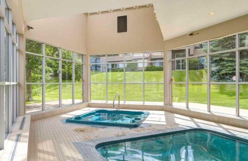 10-305 Village Mews Sw, Calgary, AB - Indoor Photo Showing Other Room With In Ground Pool