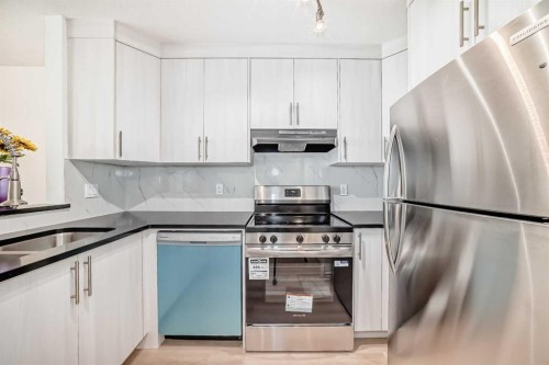 10-305 Village Mews Sw, Calgary, AB - Indoor Photo Showing Kitchen With Stainless Steel Kitchen